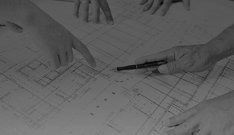 utility plans map with hands pointing to area of map